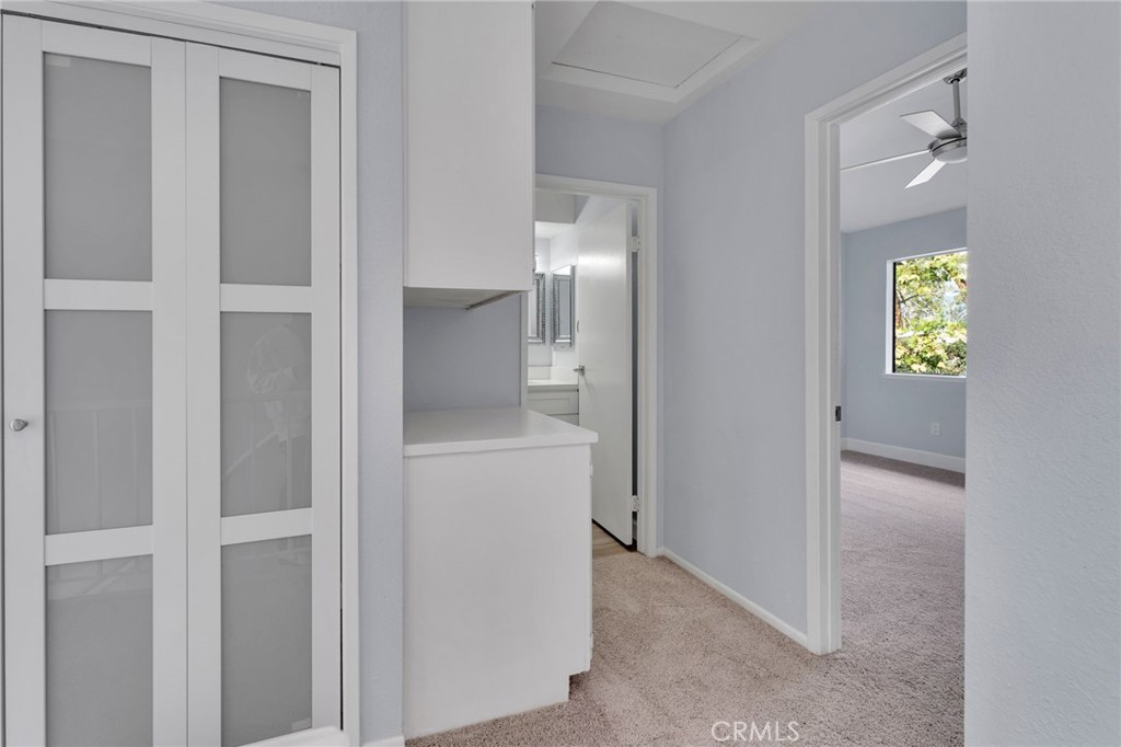 8703 Pine Crest Place Rancho Cucamonga, CA 91730 - Photo 19 of 36 a view of hallway with wooden floor and a mirror