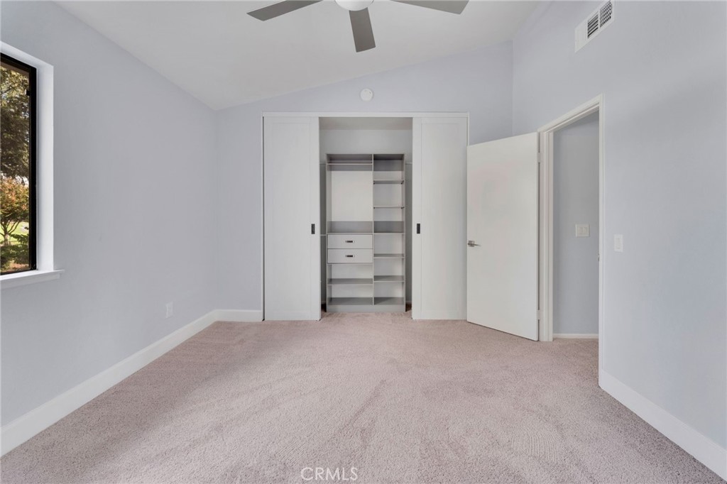 8703 Pine Crest Place Rancho Cucamonga, CA 91730 - Photo 23 of 36 an empty room with closet and windows