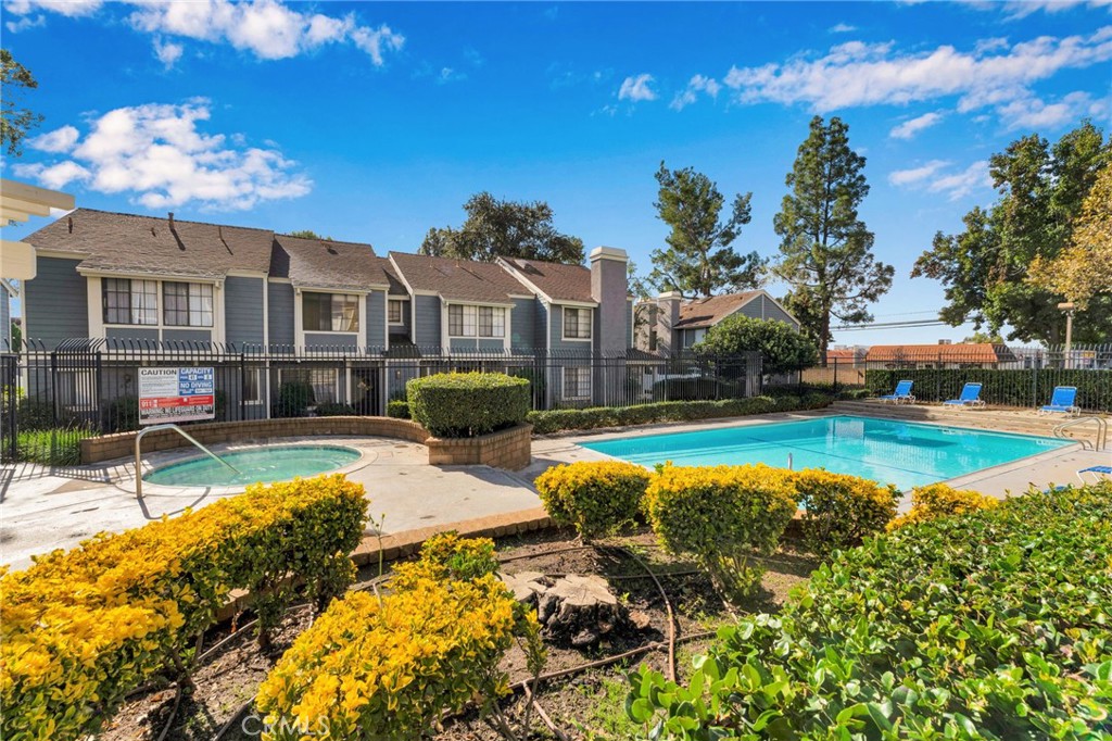 8703 Pine Crest Place Rancho Cucamonga, CA 91730 - Photo 32 of 36 a view of a house with swimming pool and sitting area