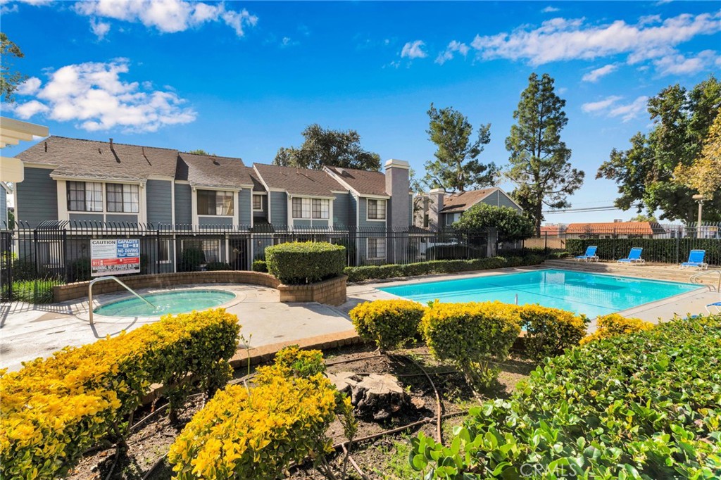 8703 Pine Crest Place Rancho Cucamonga, CA 91730 - Photo 33 of 36 a view of a house with swimming pool and sitting area