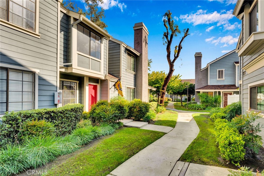 8703 Pine Crest Place Rancho Cucamonga, CA 91730 - Photo 4 of 36 a front view of a house with garden