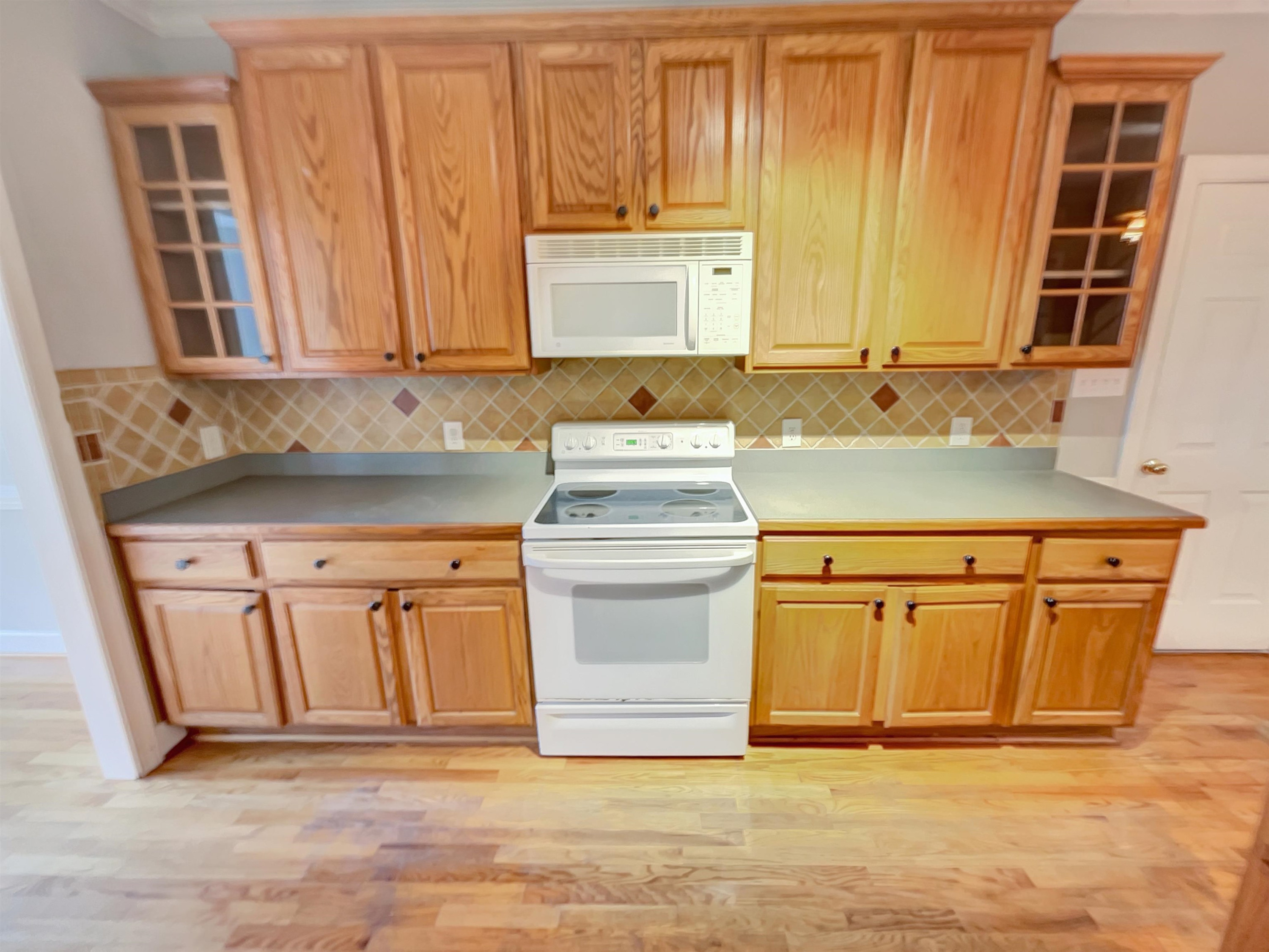 207 Normandy Drive Clayton, NC 27527 - Photo 12 of 25 a kitchen with stainless steel appliances granite countertop a sink and a cabinets