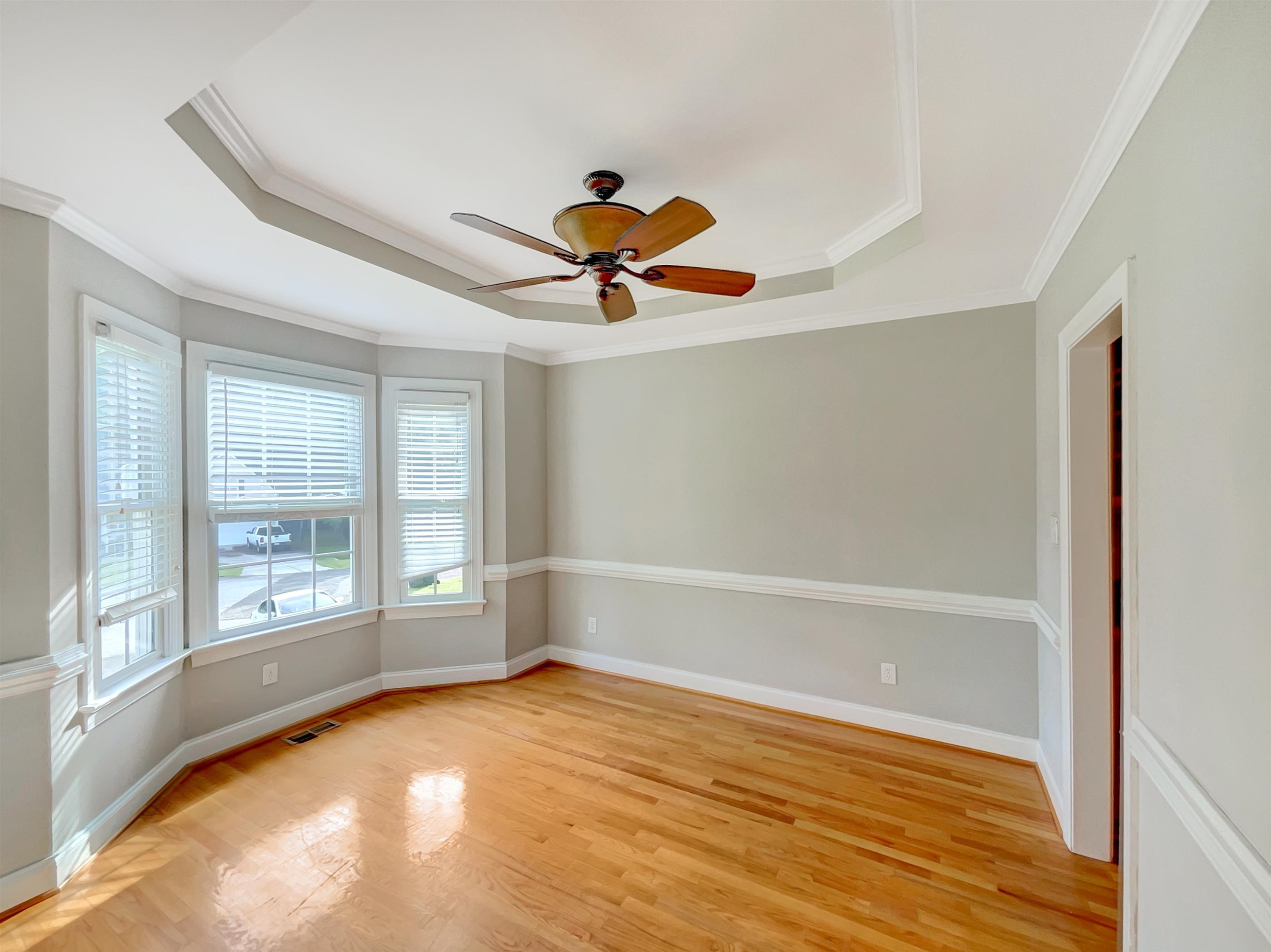207 Normandy Drive Clayton, NC 27527 - Photo 15 of 25 wooden floor in an empty room with a window