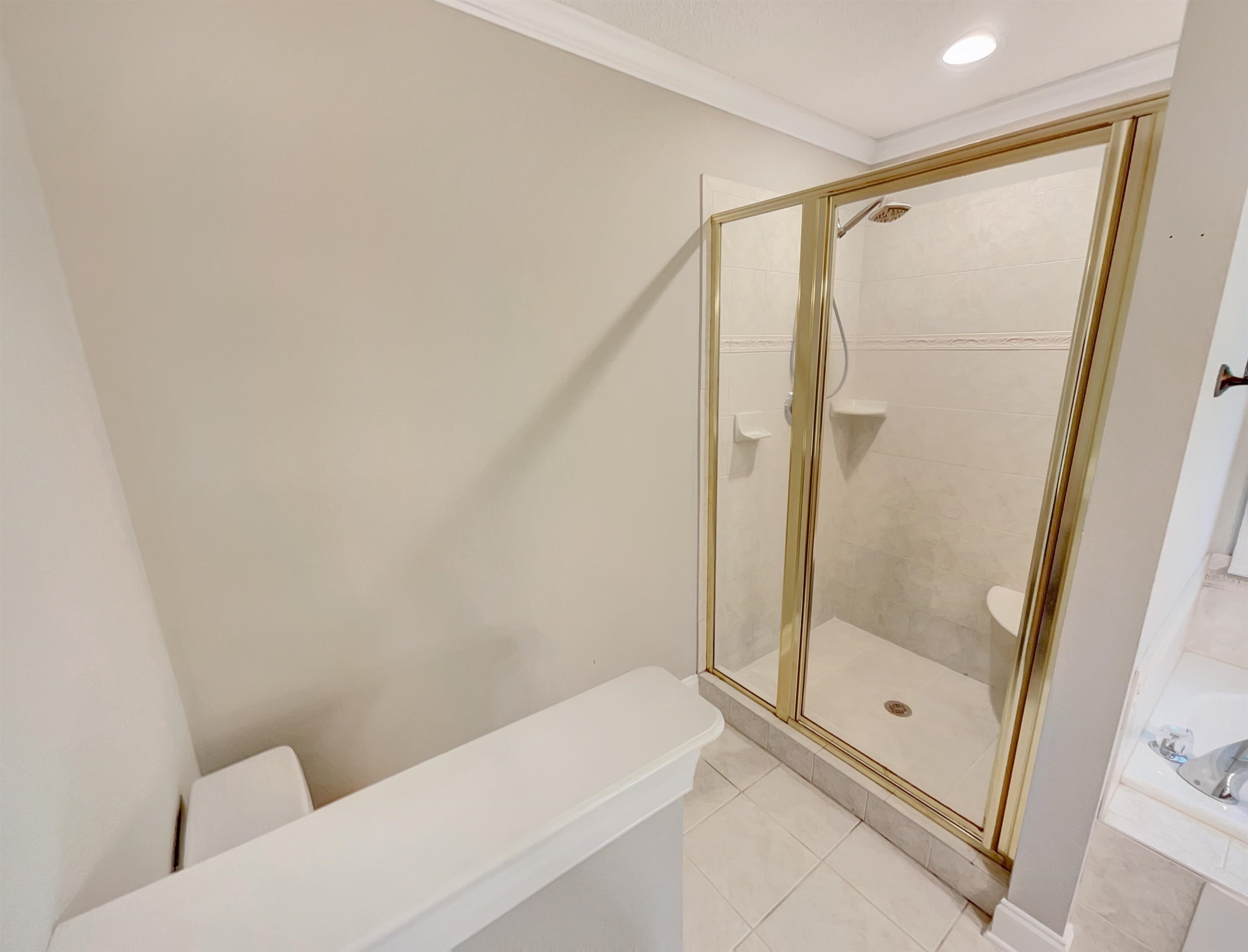 207 Normandy Drive Clayton, NC 27527 - Photo 17 of 25 a bathroom with a tub and a shower