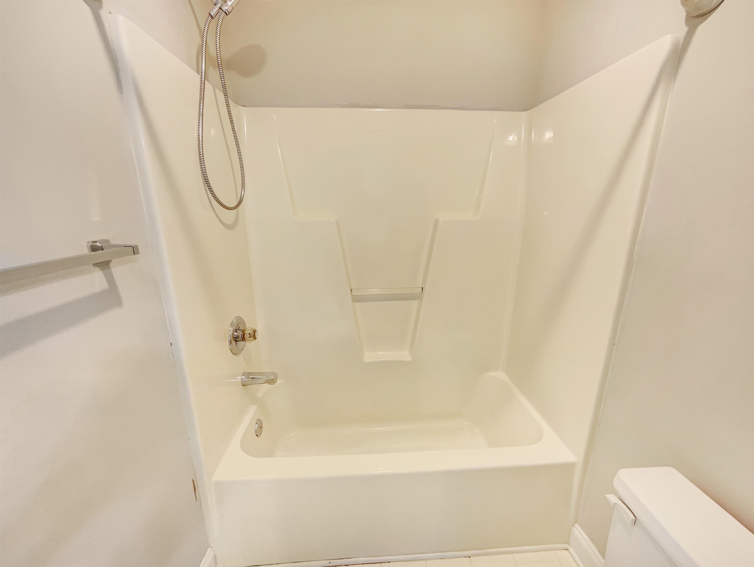 207 Normandy Drive Clayton, NC 27527 - Photo 23 of 25 a bathroom with a bathtub and a shower