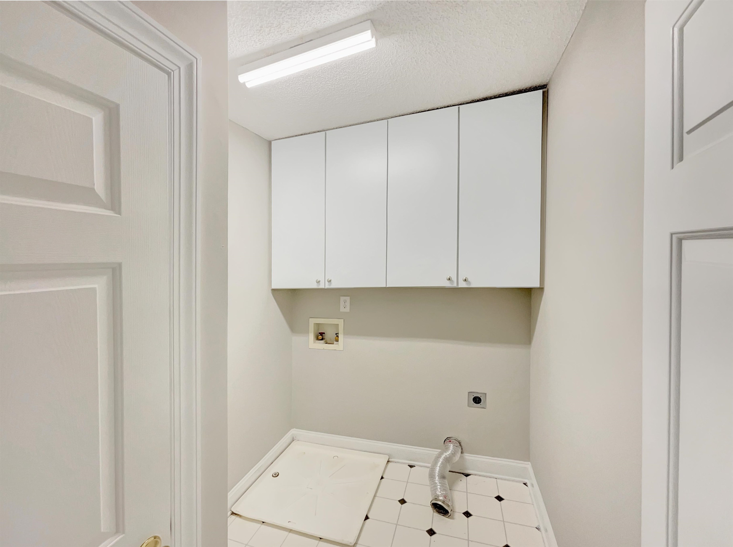 207 Normandy Drive Clayton, NC 27527 - Photo 24 of 25 a view of cabinets and utility room with empty racks