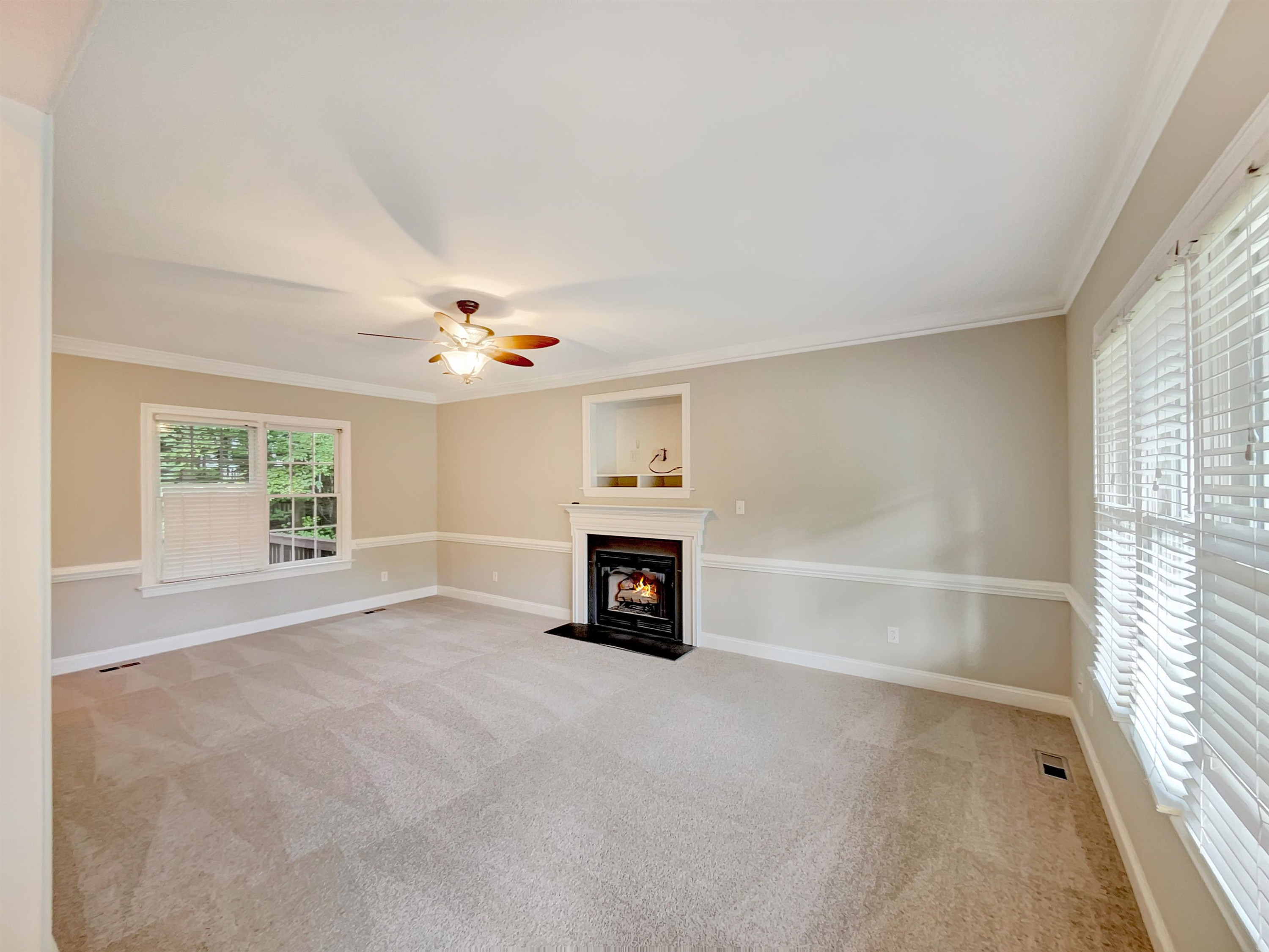 207 Normandy Drive Clayton, NC 27527 - Photo 5 of 25 an empty room with windows and fireplace