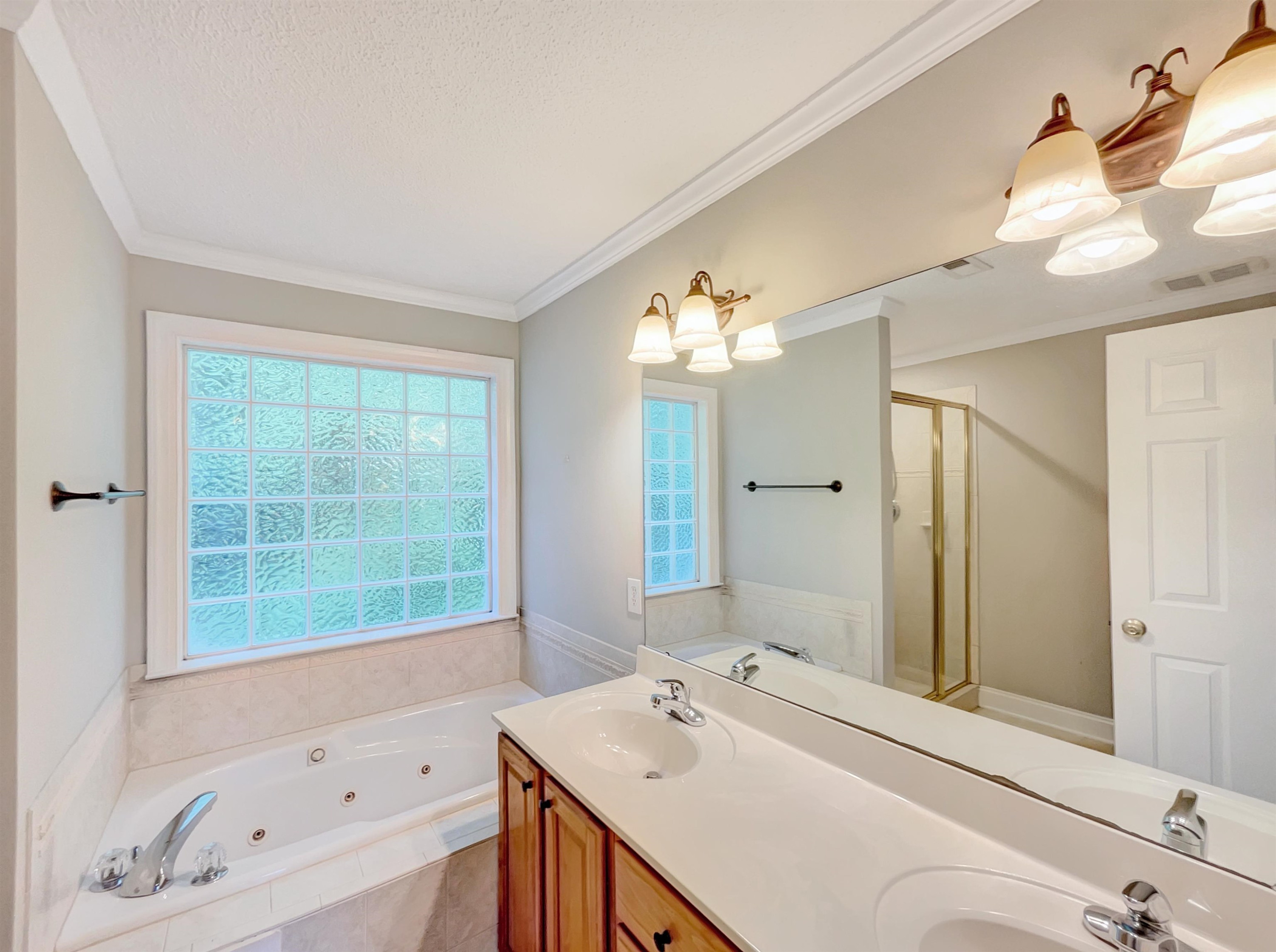 207 Normandy Drive Clayton, NC 27527 - Photo 6 of 25 a bathroom with a tub sink and mirror