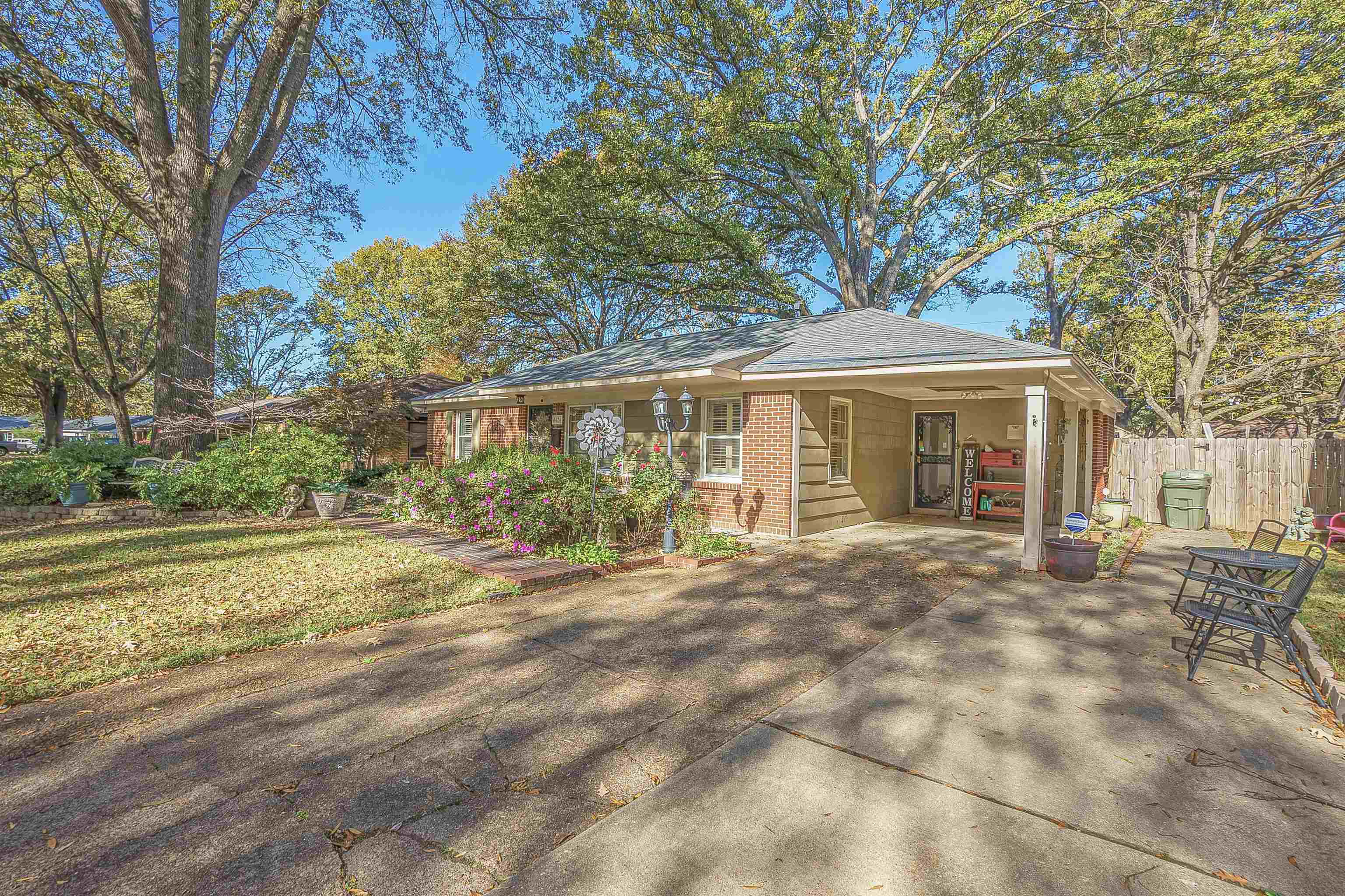 4476 Helene Road Memphis, TN 38117 - Photo 1 of 22 a front view of a house with a garden