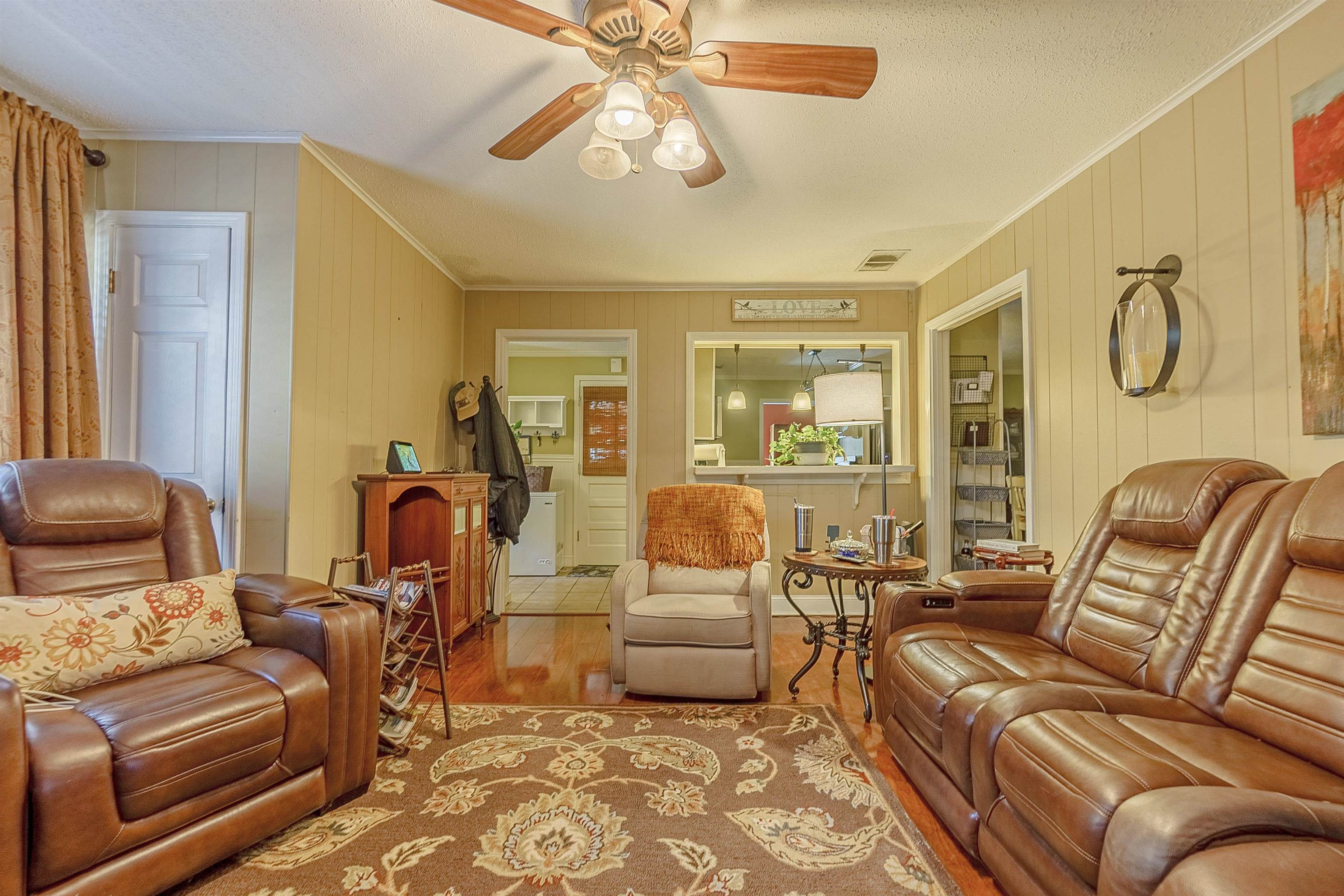 4476 Helene Road Memphis, TN 38117 - Photo 15 of 22 a living room with furniture and a chandelier