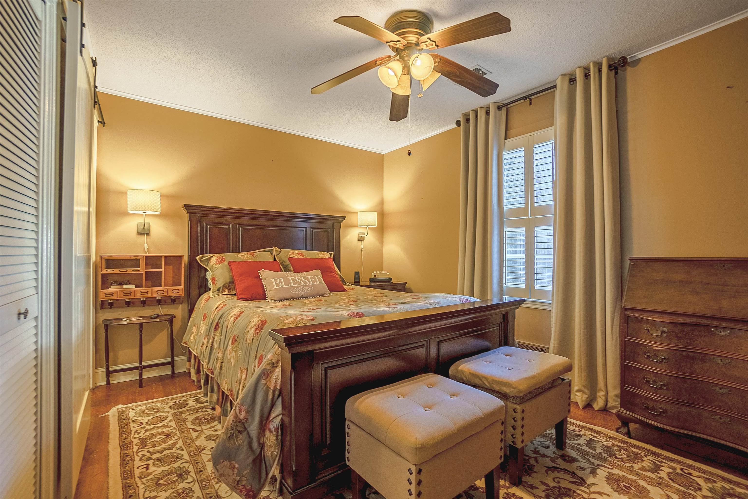 4476 Helene Road Memphis, TN 38117 - Photo 16 of 22 a bedroom with a bed and wooden floor