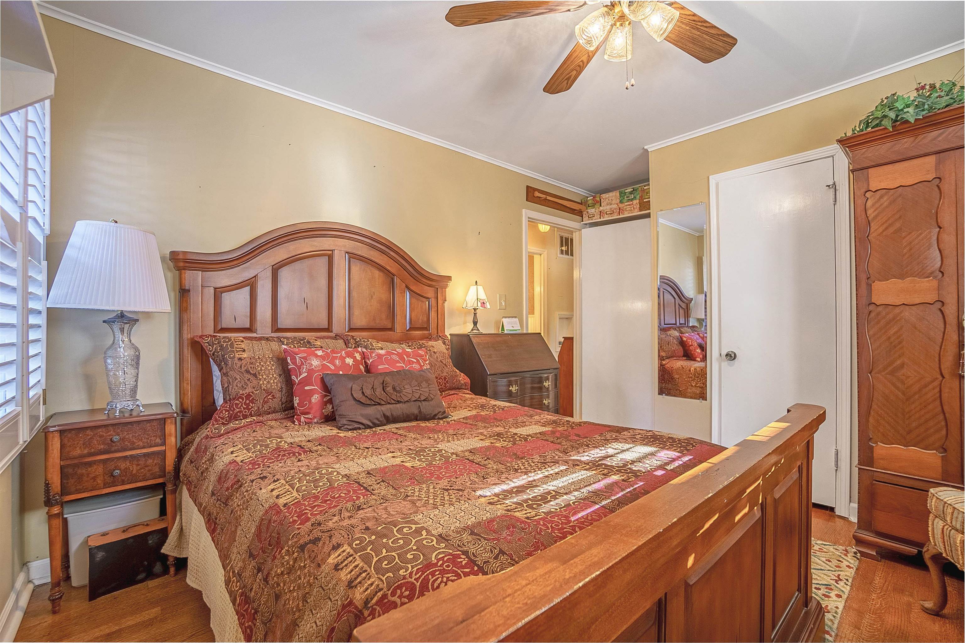 4476 Helene Road Memphis, TN 38117 - Photo 4 of 22 a bedroom with a bed and a chandelier