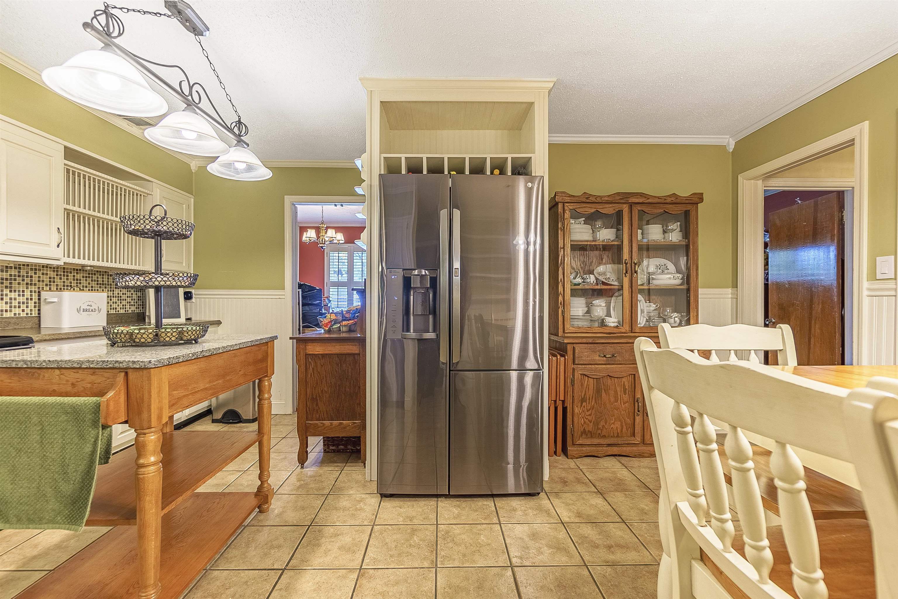 4476 Helene Road Memphis, TN 38117 - Photo 10 of 22 a kitchen with refrigerator and cabinets