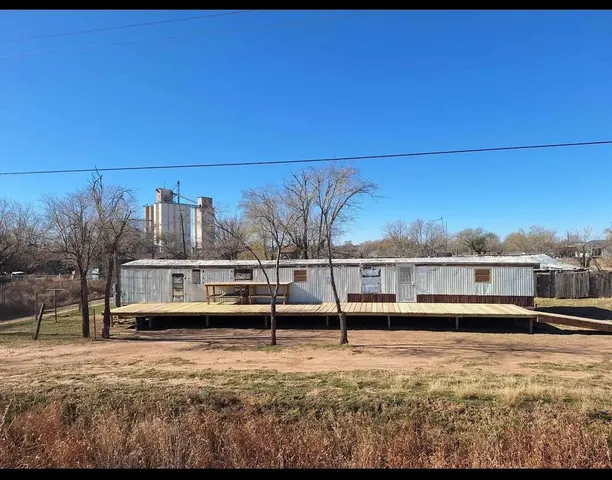 a view of a swimming pool with an outdoor seating