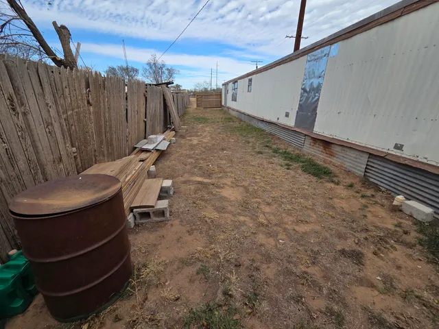 a view of backyard with seating area