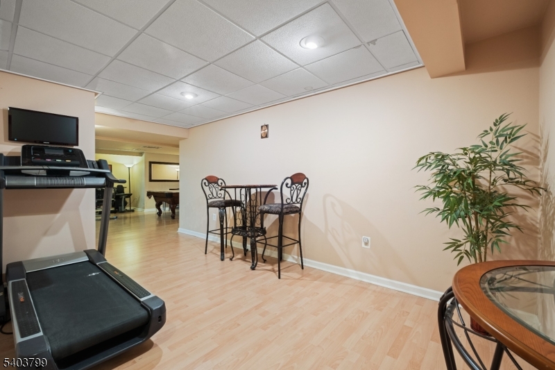 3 Summerfield Drive Princeton, NJ 08540 - Photo 12 of 30 a dining room with furniture and a flat screen tv