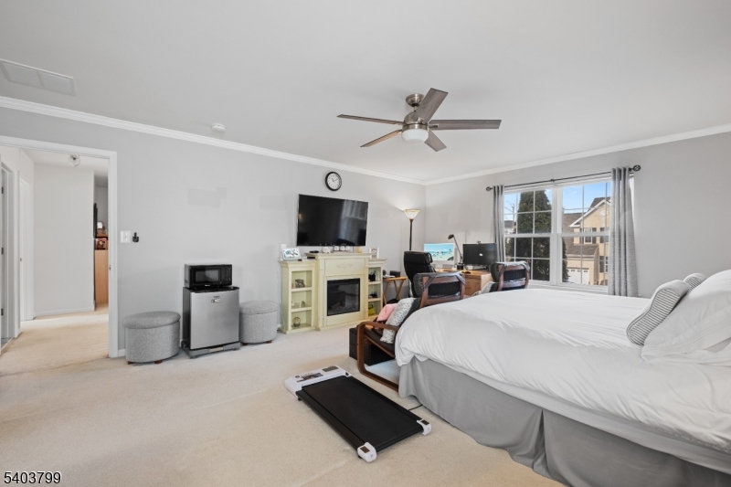 3 Summerfield Drive Princeton, NJ 08540 - Photo 19 of 30 a bedroom with a bed and a flat screen tv
