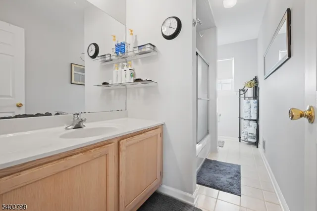 a bathroom with a sink and mirror