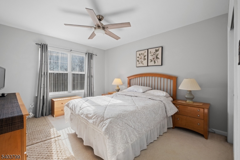 3 Summerfield Drive Princeton, NJ 08540 - Photo 24 of 30 a bedroom with a bed and wooden floor