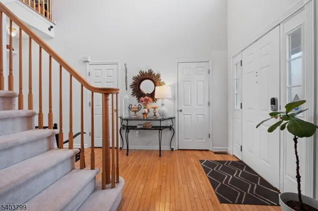 a view of a livingroom with furniture and hardwood floor