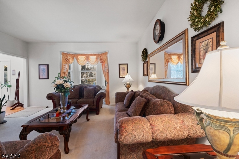 3 Summerfield Drive Princeton, NJ 08540 - Photo 5 of 30 a living room with furniture a flat screen tv and a window