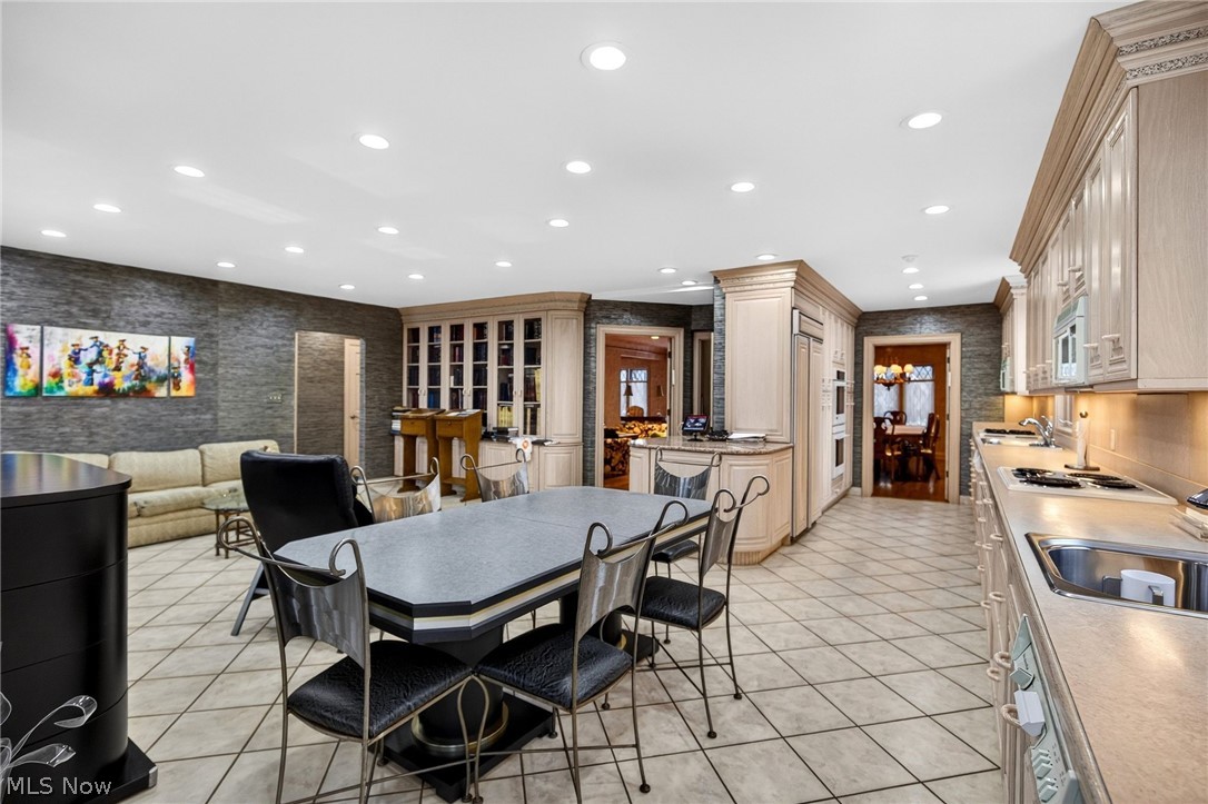 3498 Bainbridge Road Cleveland Heights, OH 44118 - Photo 19 of 50 Dining area with recessed lighting, light tile patterned floors, and wallpapered walls