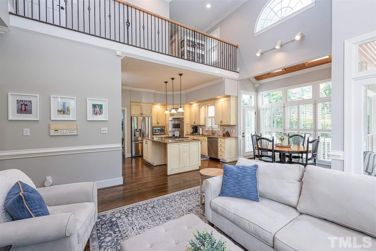 7016 North Ridge Drive Raleigh, NC 27615 - Photo 11 of 30 a living room with furniture kitchen view and a large window