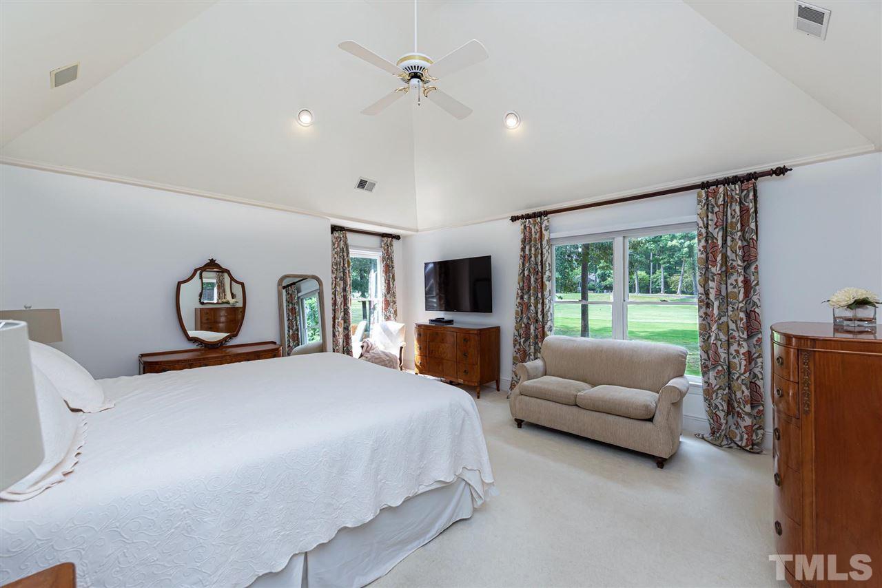 7016 North Ridge Drive Raleigh, NC 27615 - Photo 14 of 30 a bedroom with bed couch and window