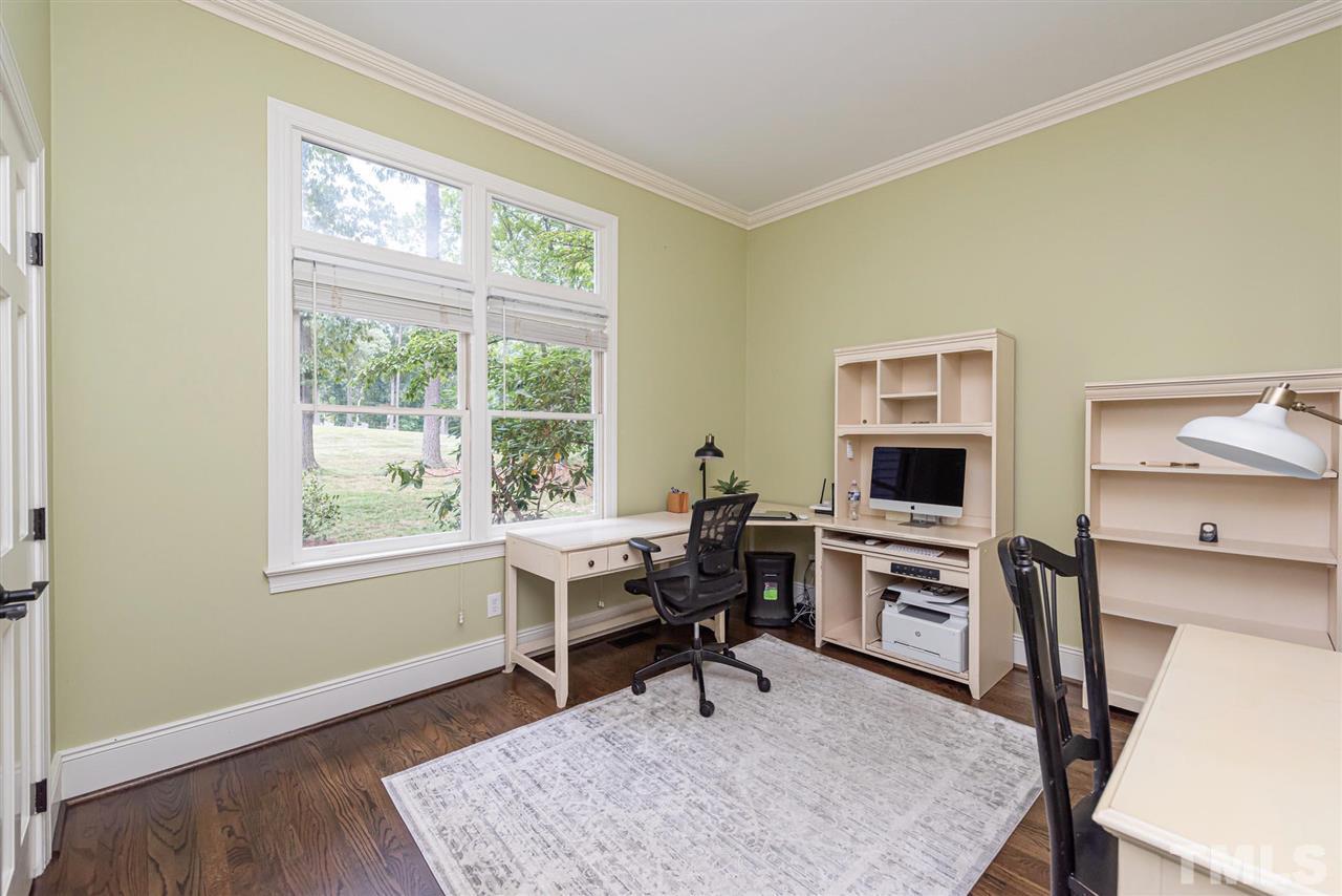 7016 North Ridge Drive Raleigh, NC 27615 - Photo 23 of 30 a view of a workspace with furniture and a window