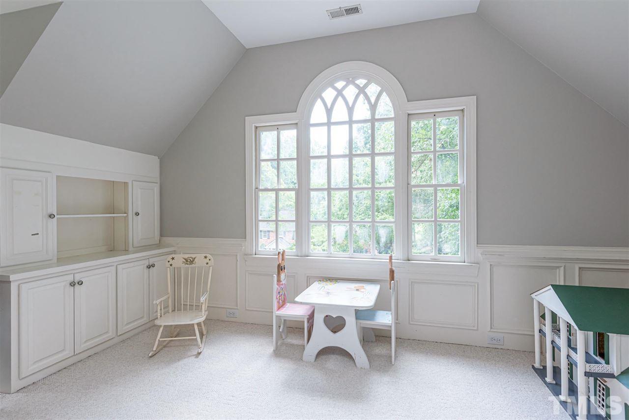 7016 North Ridge Drive Raleigh, NC 27615 - Photo 26 of 30 a view of a room with windows and lounge chair