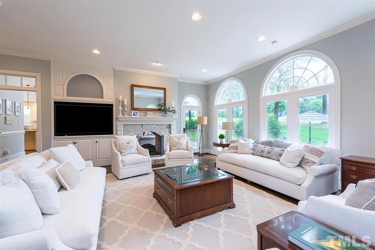 7016 North Ridge Drive Raleigh, NC 27615 - Photo 5 of 30 a living room with furniture fireplace and a large window
