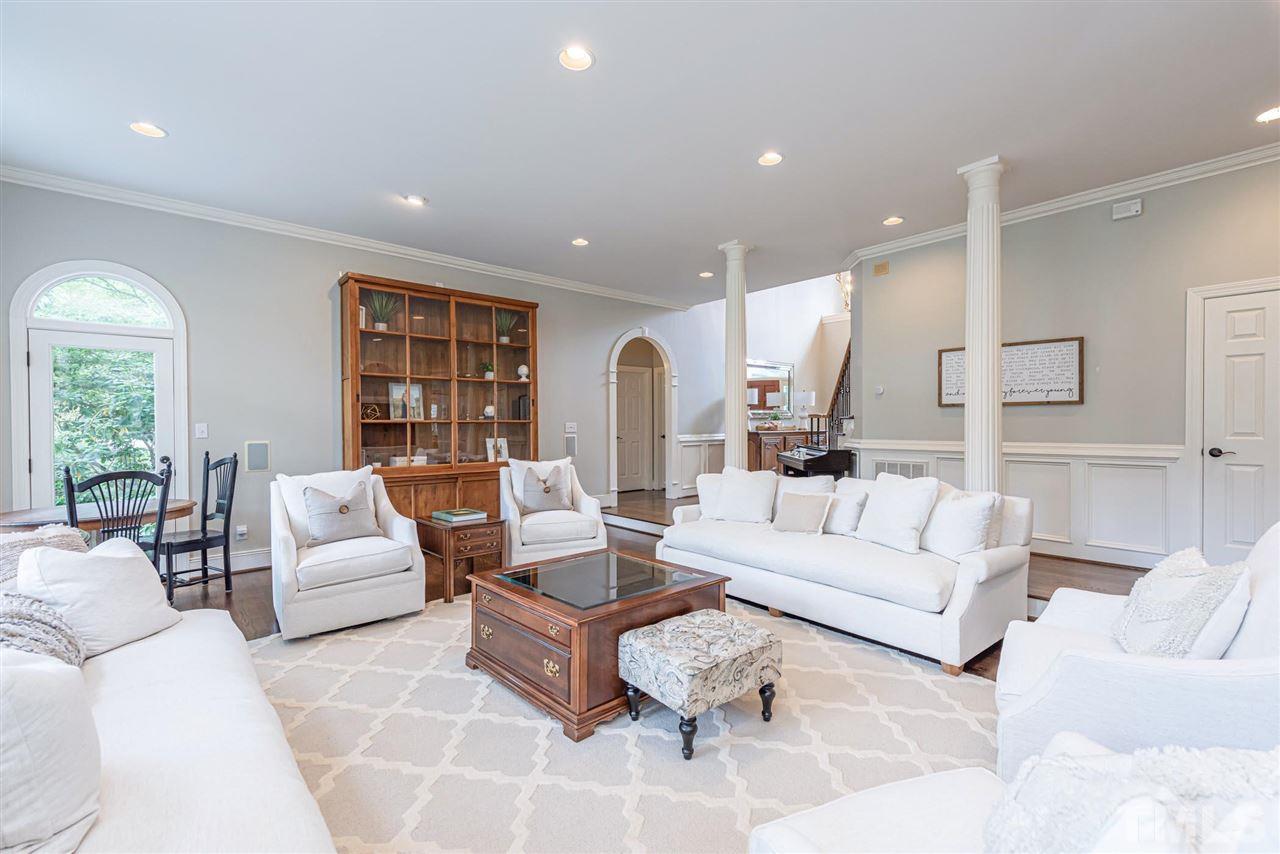 7016 North Ridge Drive Raleigh, NC 27615 - Photo 6 of 30 a living room with furniture and a large window