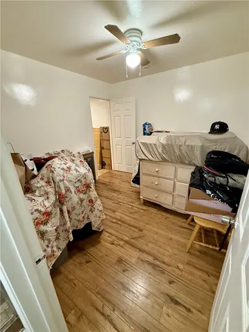a bedroom with bed and window