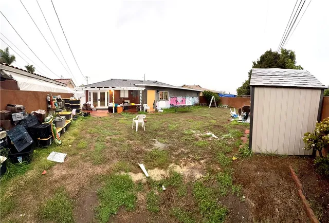 a view of a yard with cars