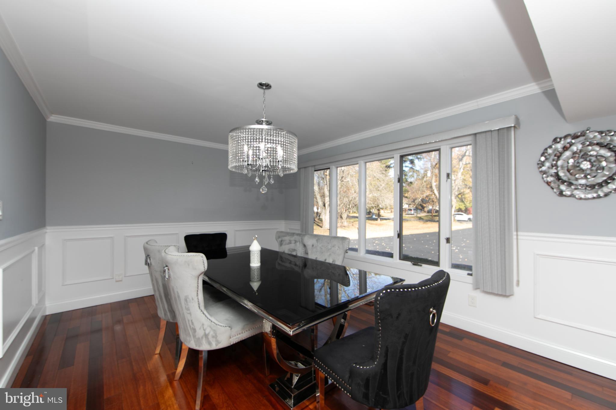 220 Landing Road Blackwood, NJ 08012 - Photo 24 of 63 a view of a dining room with furniture a chandelier and wooden floor