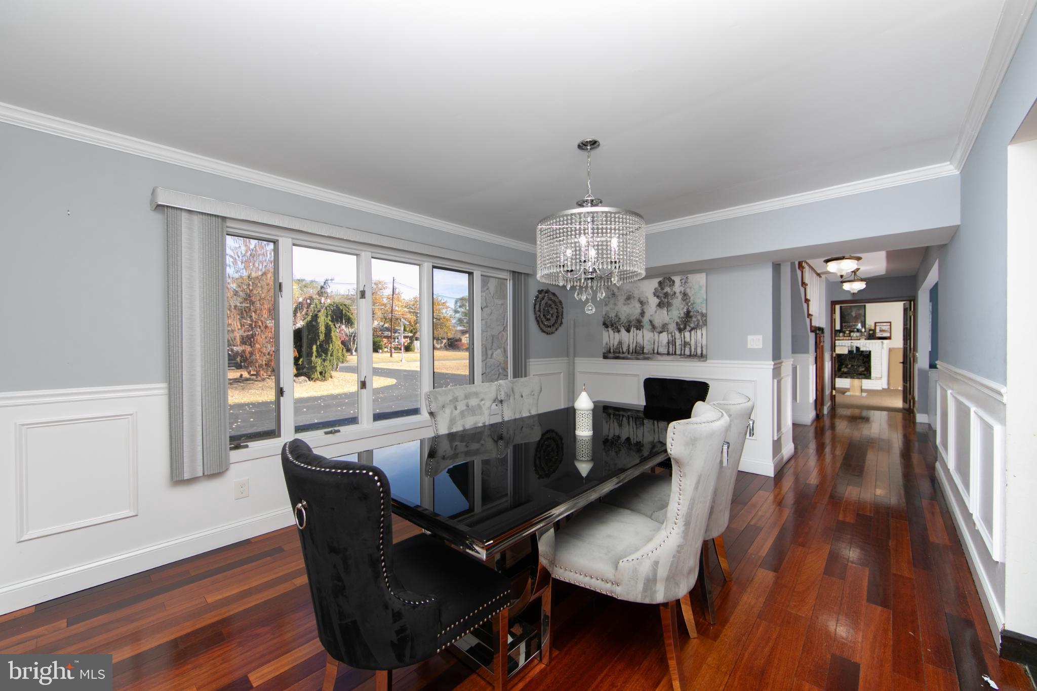 220 Landing Road Blackwood, NJ 08012 - Photo 26 of 63 a view of a dining room with furniture wooden floor and chandelier