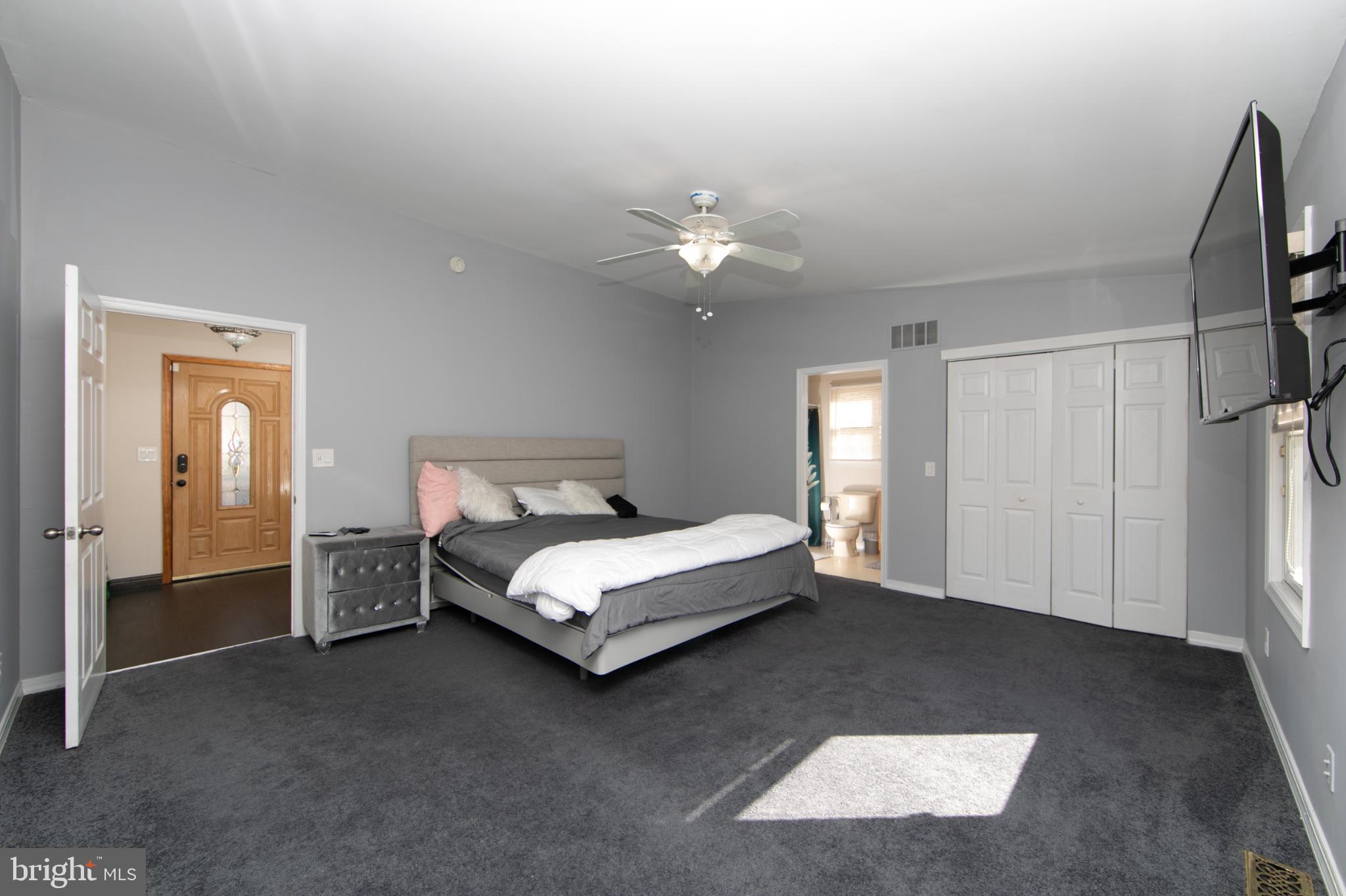 220 Landing Road Blackwood, NJ 08012 - Photo 35 of 63 a spacious bedroom with a bed and a chandelier