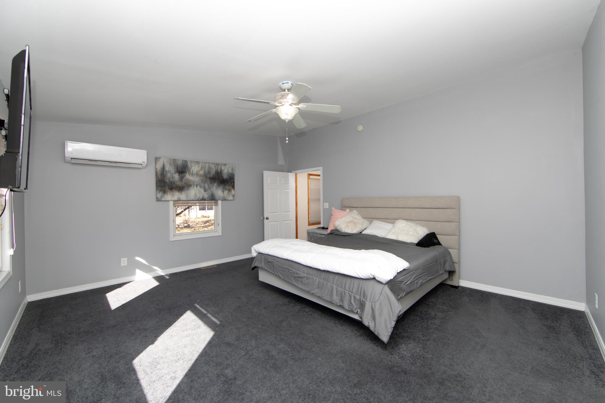 220 Landing Road Blackwood, NJ 08012 - Photo 36 of 63 a bedroom with a bed chandelier and a window