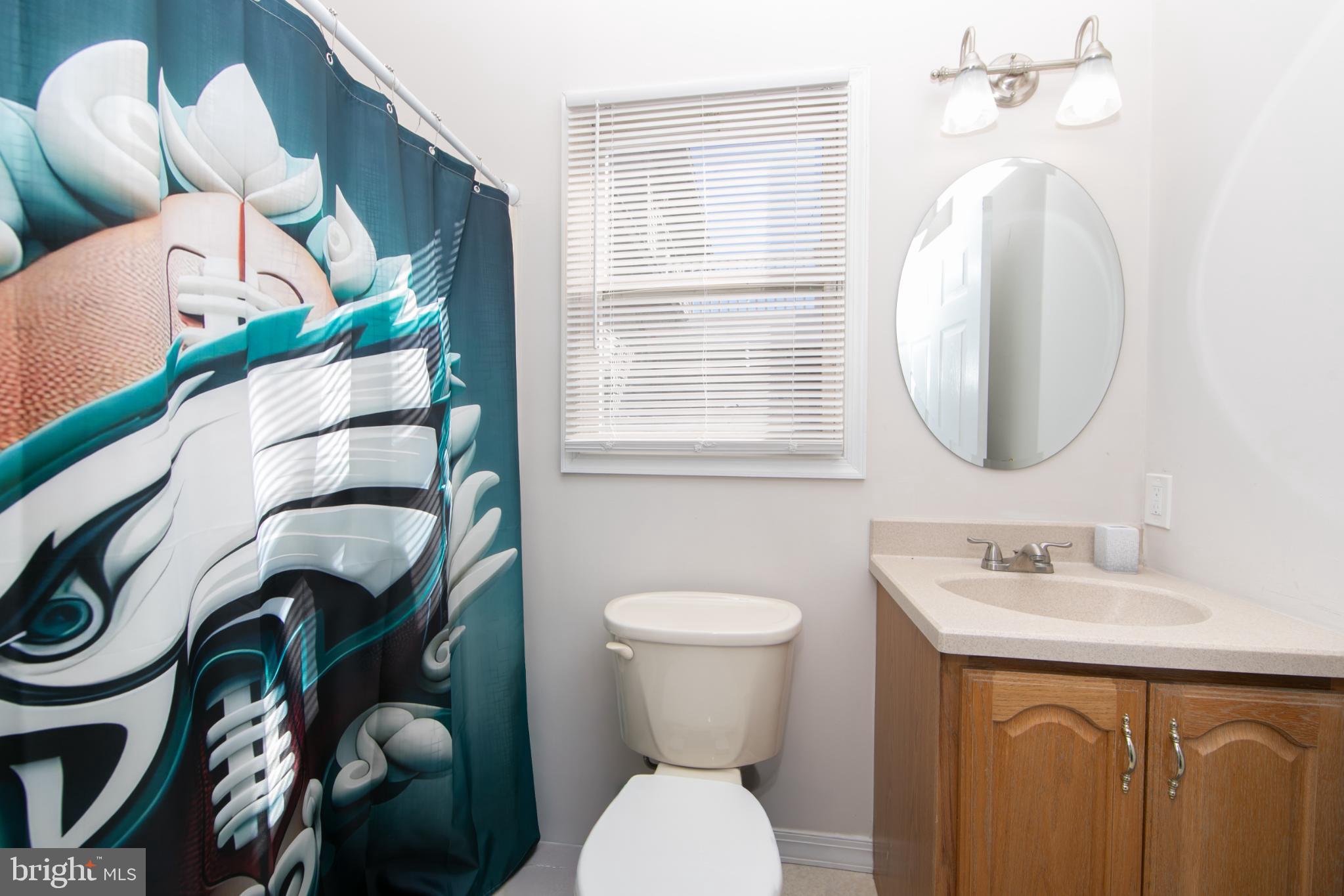 220 Landing Road Blackwood, NJ 08012 - Photo 37 of 63 a bathroom with a toilet sink and mirror