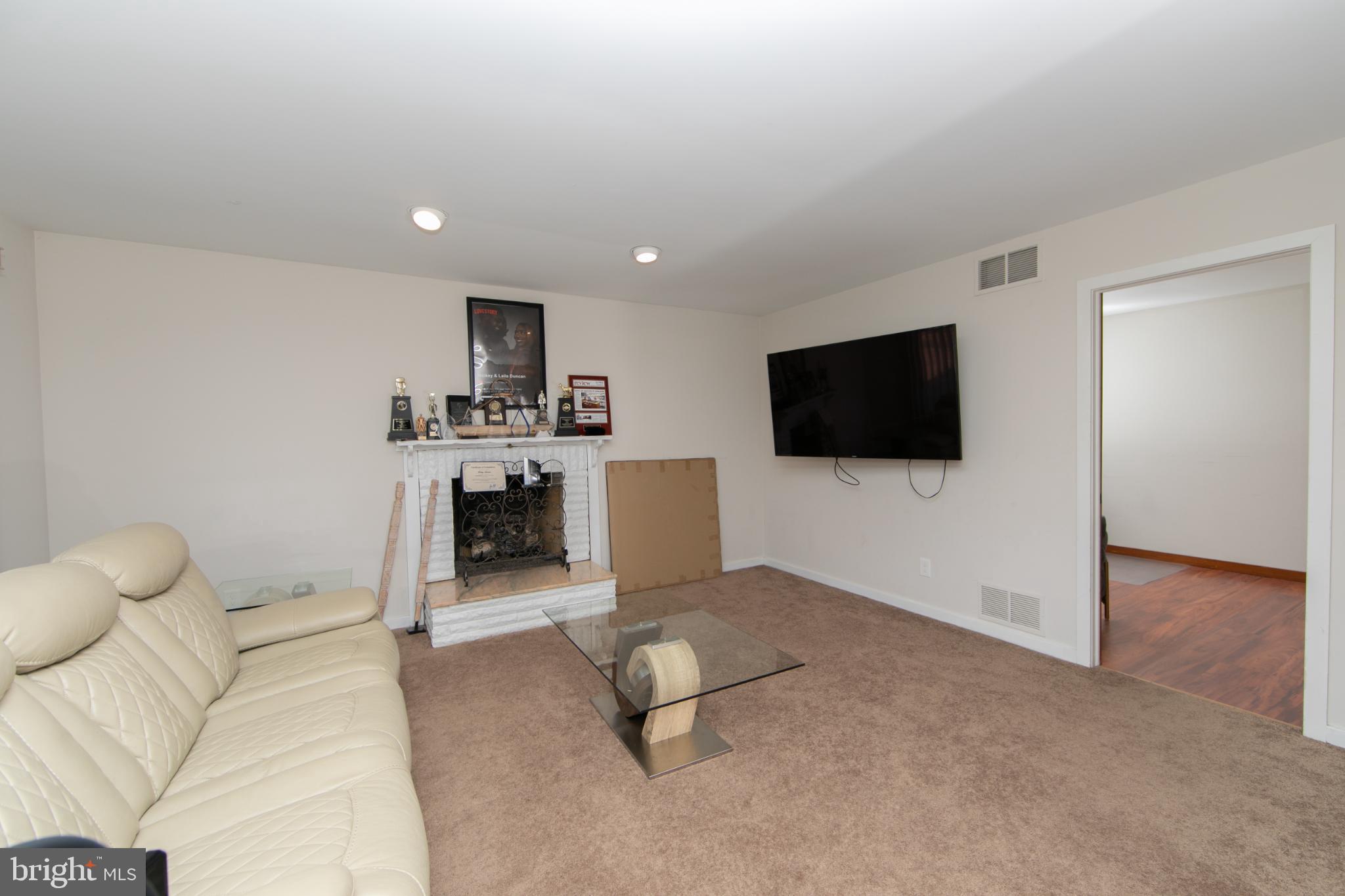 220 Landing Road Blackwood, NJ 08012 - Photo 43 of 63 a living room with furniture and a flat screen tv