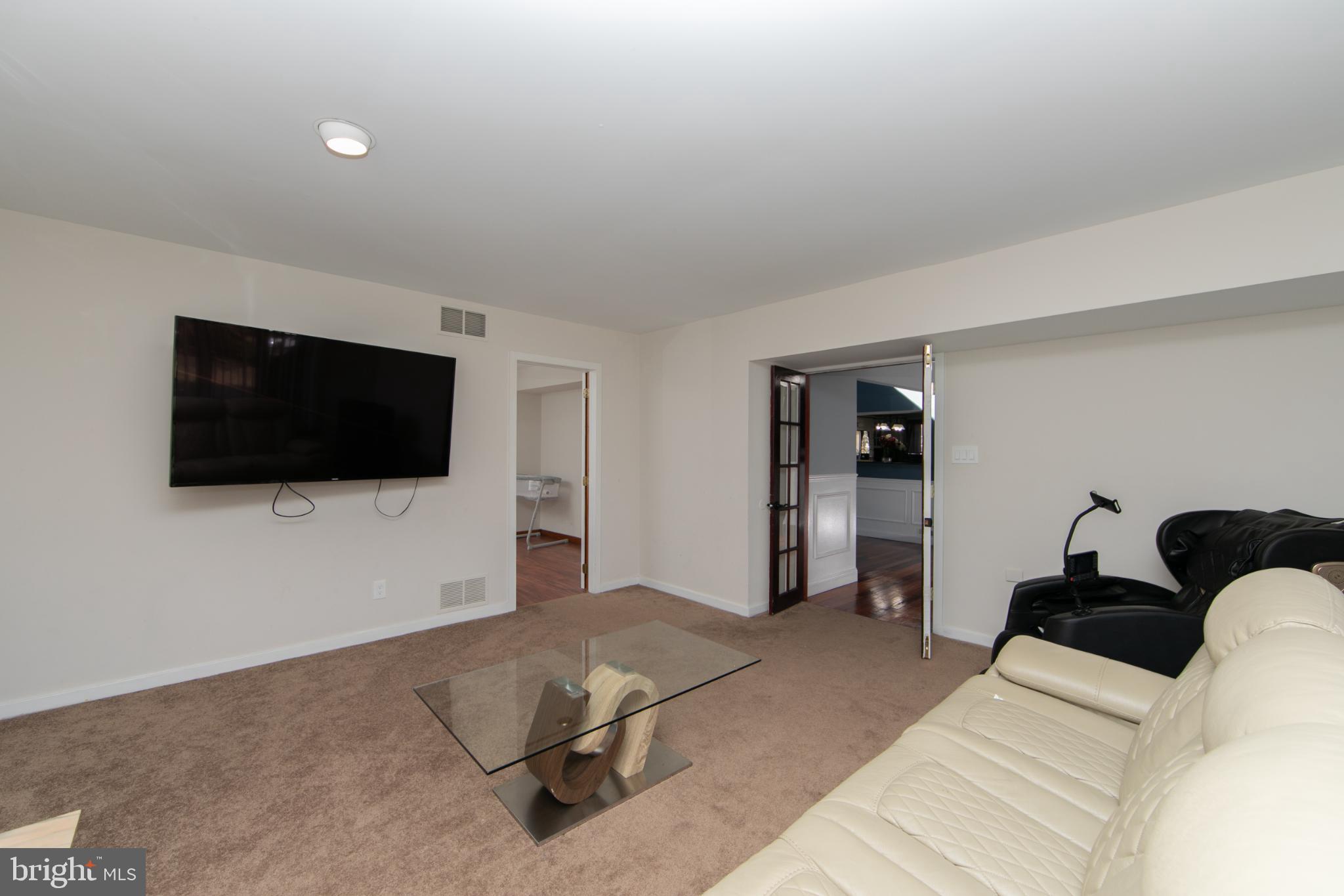 220 Landing Road Blackwood, NJ 08012 - Photo 44 of 63 a living room with furniture and a flat screen tv