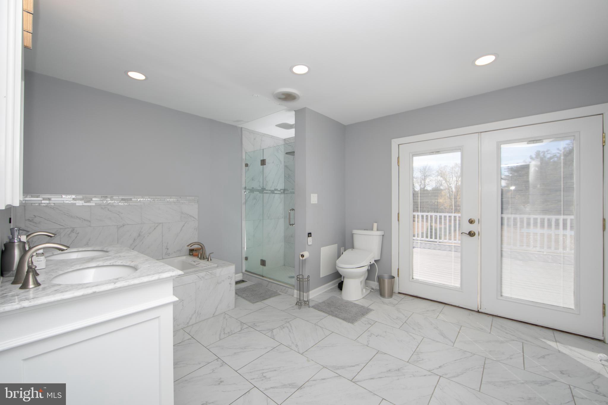 220 Landing Road Blackwood, NJ 08012 - Photo 48 of 63 a spacious bathroom with a double vanity sink a toilet and a shower
