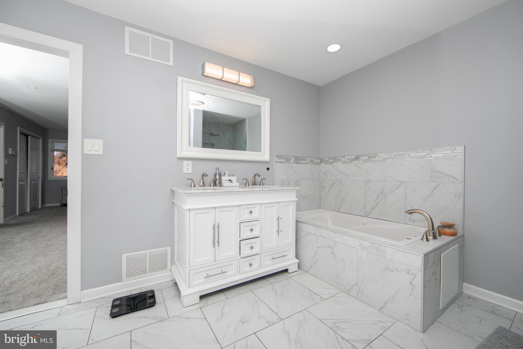 220 Landing Road Blackwood, NJ 08012 - Photo 49 of 63 a bathroom with a sink a vanity and mirror