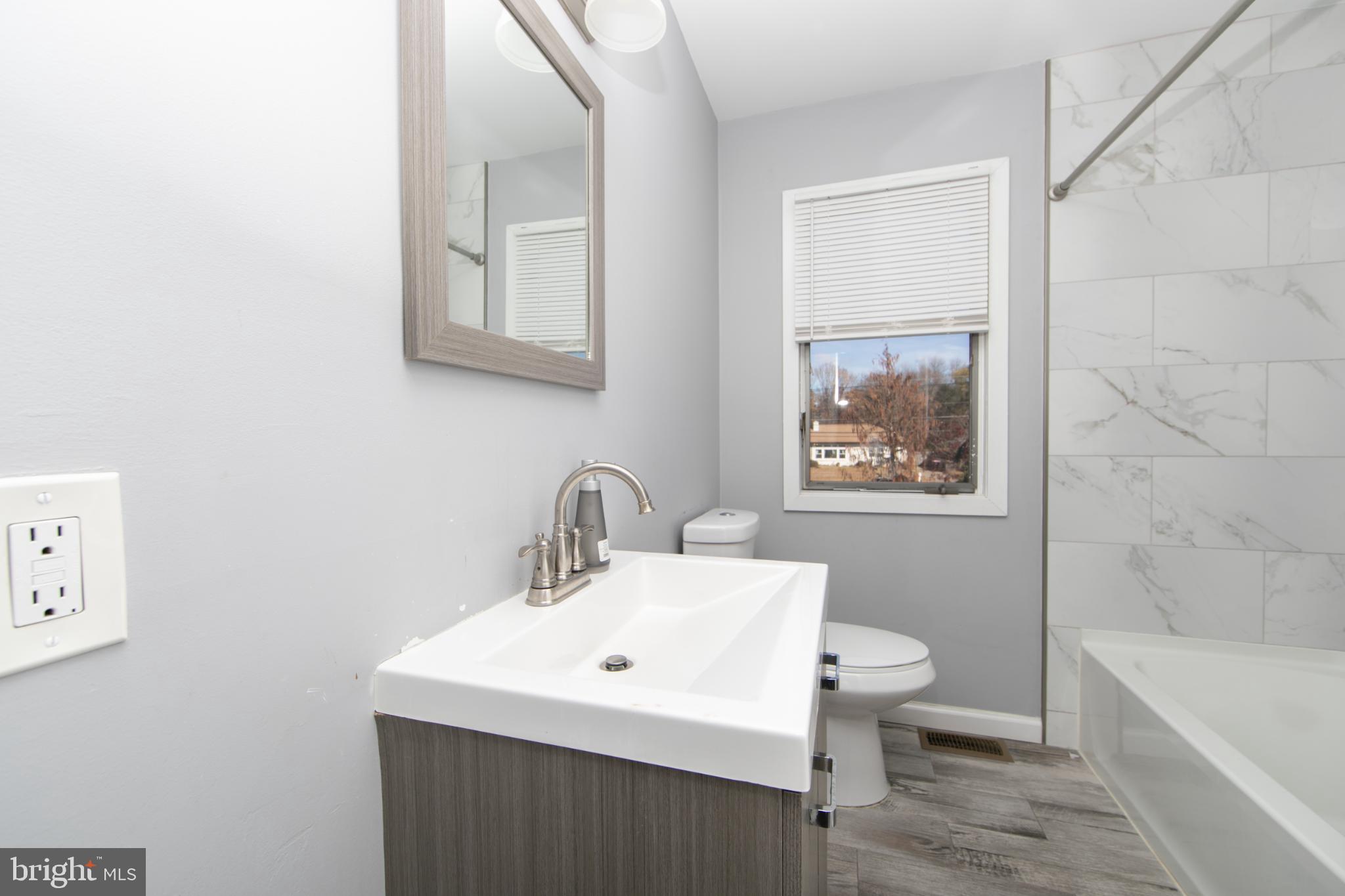 220 Landing Road Blackwood, NJ 08012 - Photo 56 of 63 a bathroom with a sink a toilet and a bathtub