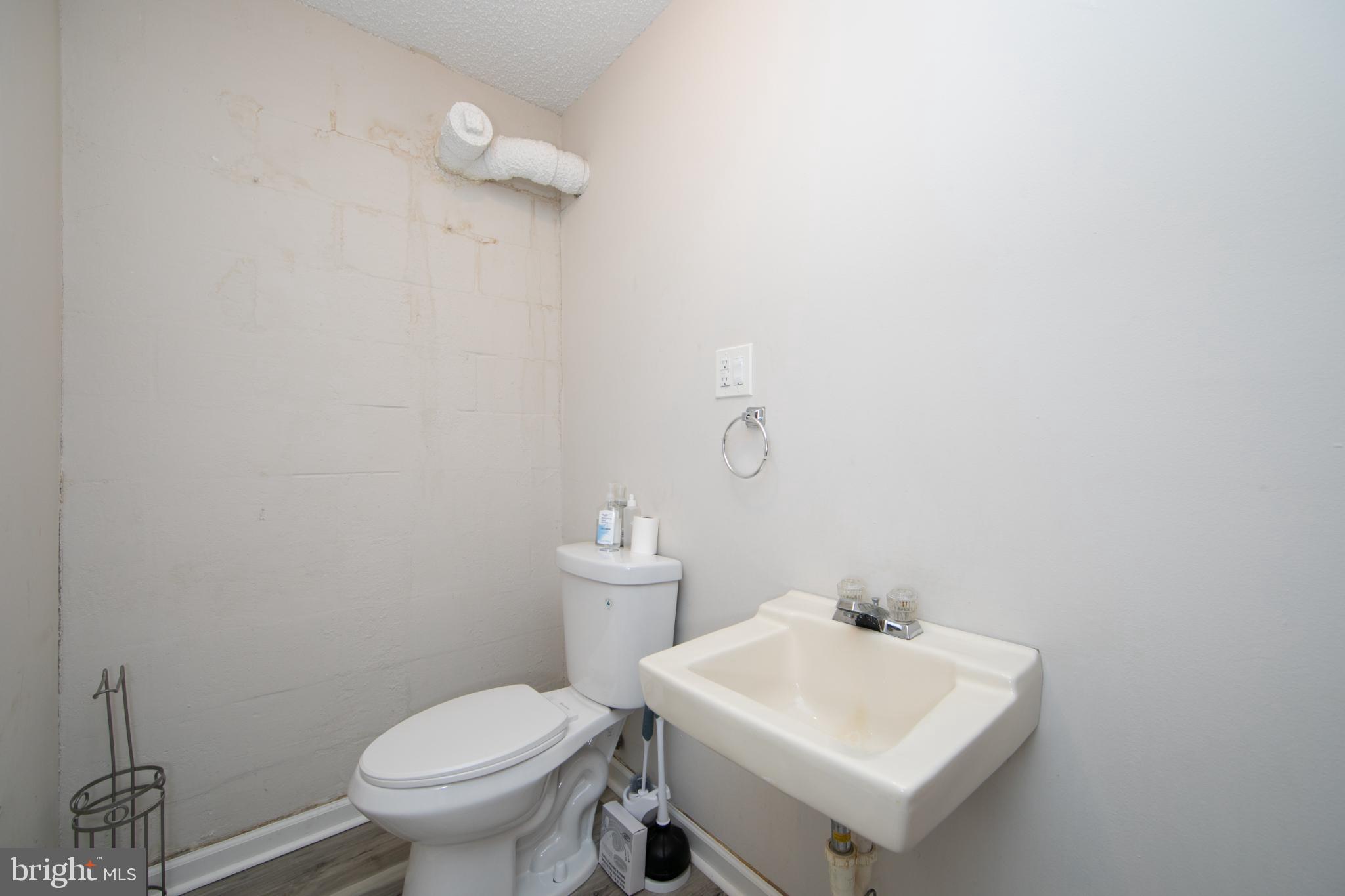 220 Landing Road Blackwood, NJ 08012 - Photo 63 of 63 a bathroom with a sink a toilet and a mirror