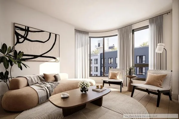 a living room with furniture and a floor to ceiling window