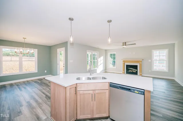 a view of a kitchen with sink and microwave