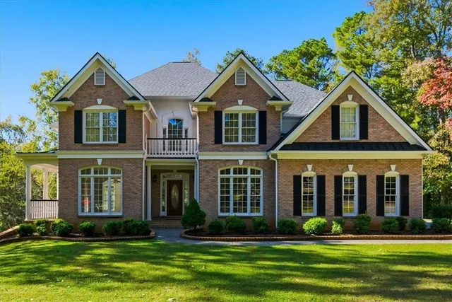 a front view of a house with a yard