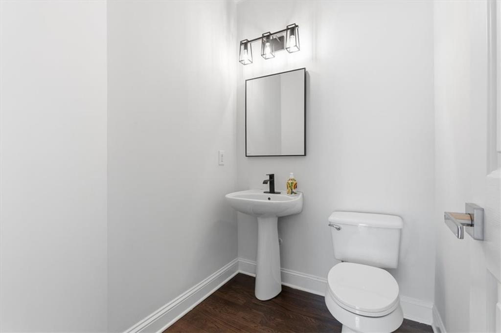 166 Windrift Drive Dallas, GA 30132 - Photo 23 of 72 a bathroom with a toilet sink and mirror