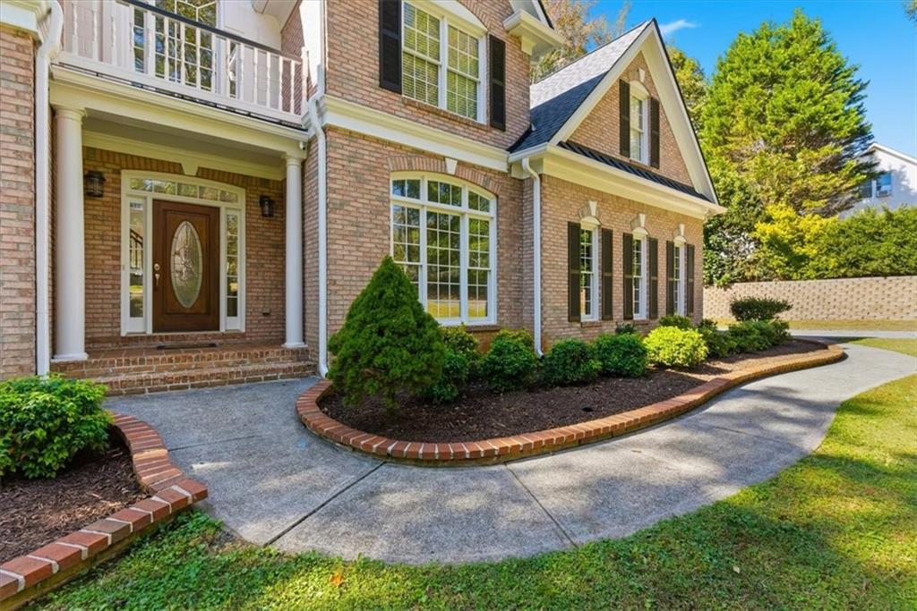 166 Windrift Drive Dallas, GA 30132 - Photo 4 of 72 a front view of a house with garden